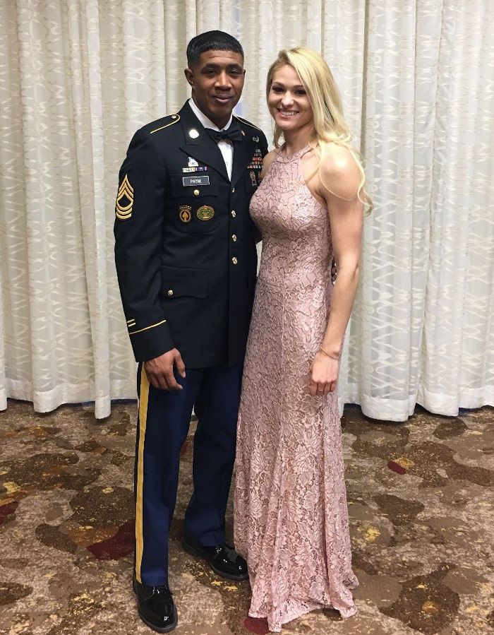Jason in Army dress uniform beside Ellie in a formal gown at a military ball.