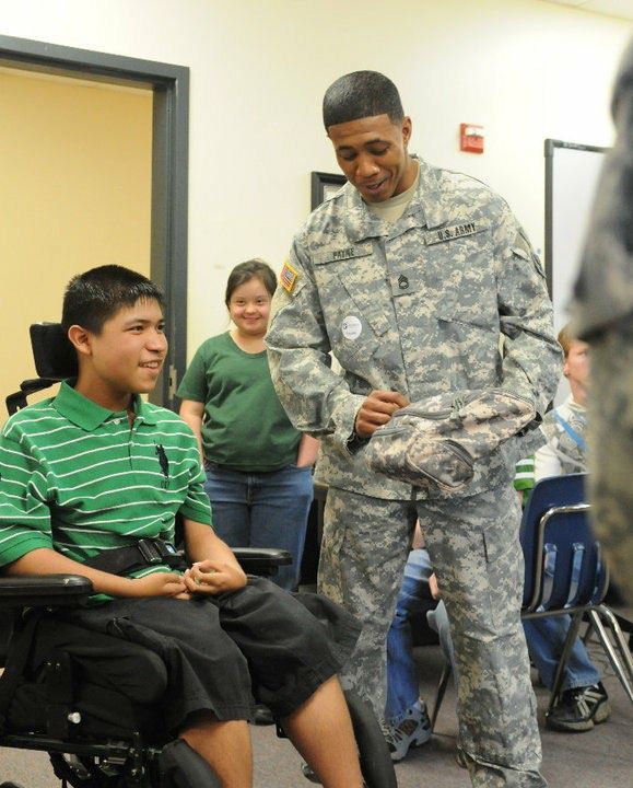 Jason connecting with a young person during a community service visit.