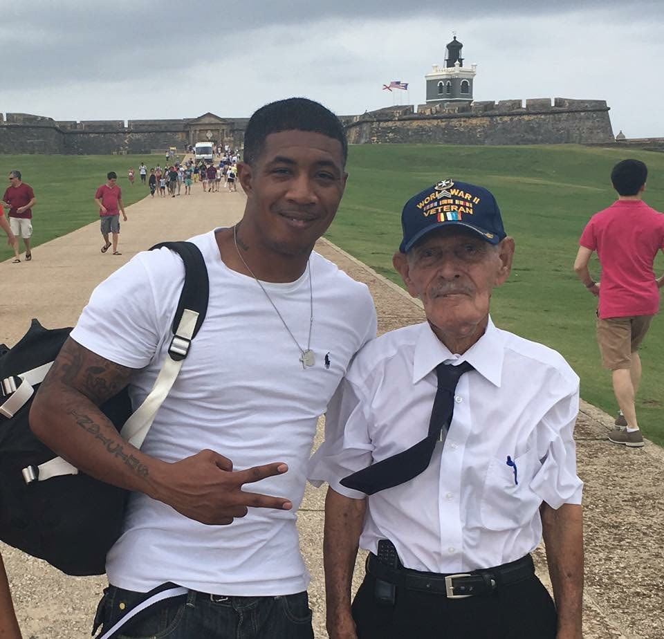 Jason with an elderly World War II veteran in front of a historic fort in Puerto Rico.